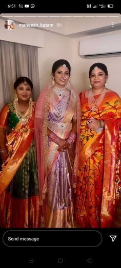 three women in sari standing next to each other