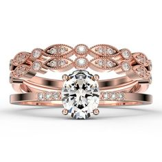 a rose gold wedding ring set with an oval cut diamond in the center and two rows of diamonds on each band