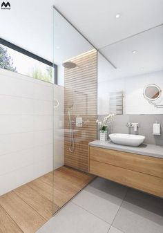 a modern bathroom with two sinks and a shower stall in the middle of the room