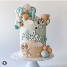 a birthday cake decorated with an animal theme