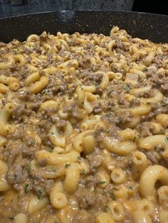 macaroni and cheese with ground beef in a skillet on the stove top