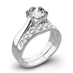 a white gold engagement ring with diamonds on it