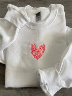 White Custom Embroidered Sweatshirt For Spring, White Sweatshirt With Custom Embroidery For Spring, Spring White Sweatshirt With Custom Embroidery, Spring White Sweater With Embroidered Logo, White Floral Embroidered Sweatshirt For Fall, Spring Crew Neck Sweatshirt With Custom Embroidery, Crew Neck Sweater With Custom Embroidery For Spring, Cotton Sweatshirt With Heart Graphic And Long Sleeves, Cotton Sweatshirt With Heart Graphic For Winter