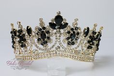 Beautiful sparkling tiara in gold color with black stones Approx. 3" tall Perfect for any occasion. It has a loop at the end of each side to attach it in your hair with bobby pins for added security. Ships 1-2 business days. Royal Gold Crown For Parties, Royal Gold Party Crown, Royal Teardrop Crown For Party, Elegant Gold Crown With Rhinestones, Royal Crown With Pinched Crown For Party, Black Tall Crown For Party, Black Tall Crown For Parties, Black And Gold Crown, Girls Tiara