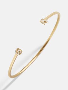 Orders placed between 11/27 - 12/4 will ship between 12/26 - 1/2/25.Our 18K Gold Double Initial Custom Cuff Bracelet is an updated take on a classic initial accessory. Available in an all-gold and a subtle sparkly version, these bracelets are ones you'll have for years to come. Add your own initials or that of you and a loved one to create a keepsake you'll cherish. Not to mention, this cuff bracelet is crafted with 18K gold plated sterling silver and Cubic Zirconia stones. Luxury Bracelets With Initials For Anniversary, Luxury Yellow Gold Name Bracelet With Initials, Luxury Gold Bracelets With Initials, Custom Cuff Bracelet, Customised Bracelets, Gold Bracelet Cuff, Gold Cuffs, Jewelry Lookbook, Initial Bracelet