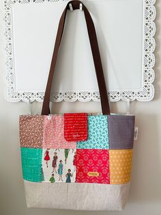 This is the perfect size for an everyday tote bag in popular Lori Holt cotton charm squares with cotton interior.  The inside features full width pocket with 3 sections and is very roomy. Bottom is linen fleeced for stability. 1" webbing is used on the straps which are 33" to wear over the shoulder. Includes a tab with magnetic snap to keep possessions safely inside.  This listing is for the tote bag only.  Care instructions:  This bag is made of 100% cotton and linen. I recommend spot cleaning Everyday Patchwork Tote Shoulder Bag, Patchwork Shoulder Bag For Everyday, Everyday Patchwork Shoulder Bag, Everyday Cotton Square Bag, Everyday Square Cotton Bag, Square Everyday Shoulder Bag, Everyday Square Cotton Bags, Everyday Square Fabric Shoulder Bag, Everyday Fabric Shoulder Bag With Pockets