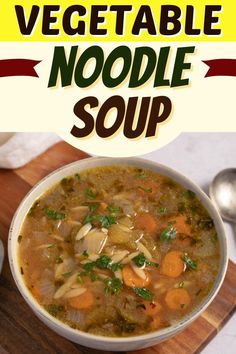 a bowl of vegetable noodle soup on a cutting board