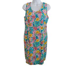 70's  sheath vintag70's  floral dress, 70's flower power dress, vintage Size 12This stunning vintage sheath dress is a must-have for any fashion-forward woman. With a beautiful floral pattern and vibrant multi-color palette, it's perfect for any casual occasion. The dress is made from a comfortable cotton blend material and features a shoulder-to-shoulder measurement of 13.5 inches, making it a great fit for a Size 12 figure. The dress has a mod/go-go style and a vintage look that's sure to turn heads. It was originally designed in the 1970s by Betsy Lauren and has since been preserved in Indonesia. The dress is 36 inches long and is perfect for any woman who wants to add a touch of vintage flair to her wardrobe. Retro Fitted Floral Summer Dress, Retro Sleeveless Midi Dress With Floral Print, Summer Sleeveless Sheath Dress With Floral Print, Fitted Retro Floral Dress For Summer, Summer Floral Print Sheath Dress, Fitted Vintage Sleeveless Dress For Spring, Sheath Sleeveless Dress For Summer, Retro Sleeveless Dress With Floral Print For Spring, Retro Fitted Floral Dress For Spring