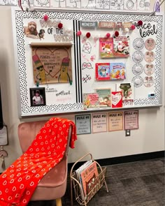 a bulletin board with pictures and magnets on it in an office cubicle decorated for valentine's day