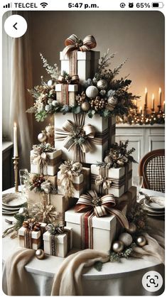 a christmas tree made out of presents on top of a table