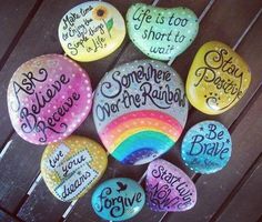 painted rocks with sayings on them are arranged in a circle