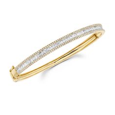 Dress up your everyday stack with this beautiful baguette and pave bangle. Available in 14K White Gold, Yellow Gold, or Rose Gold Diamond weight =1.75 carats Bangle width = 0.20in Bangle is oval shaped with a side clasp Wrist sizes: XS = 15-16cm Small = 17cm Classic Bangle With Baguette Diamonds Cut, Gold Bangle Bracelet With Baguette Diamonds, Paving Edging, Modern Bangle, Pave Bangle, Diamond Baguette, Diamond Stacks, Modern Bracelets, Double Diamond