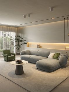 a living room with a couch, chair and coffee table in front of a large window