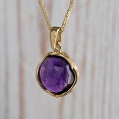 "Unique Purple Amethyst Pendant Necklace, made of 14K Solid Yellow Gold, Round Shaped, Fine Jewelry for Women, Handmade By AditaGold. This beautiful handmade short necklace is made of 14K yellow gold and gorgeous round shaped purple amethyst gemstone. Amethyst is February's birthstone, and this solid gold and amethyst necklace will be perfect for any occasion.  It is classic and elegant and will add a beautiful sparkle to a day or evening look. This necklace is the perfect gift, a meaningful way Yellow Gold Amethyst Necklace Hallmarked, Hallmarked Amethyst Round Pendant Necklace, Spiritual Yellow Gold Amethyst Necklace, Yellow Gold Amethyst Round Pendant Necklace, Amethyst 14k Stamped Jewelry For Gift, 14k Stamped Amethyst Jewelry Gift, Amethyst Jewelry Stamped 14k Gift, Yellow Gold Amethyst Birthstone Necklace, Aquarius February