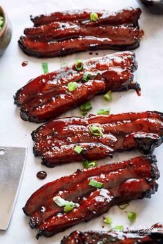 bbq ribs with sauce and green onions on the side