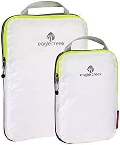 two pieces of luggage sitting side by side on top of each other, one with an eagle creek logo