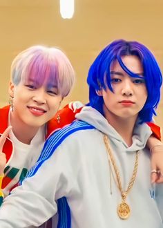 two young men with blue hair standing next to each other