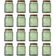 green glass jars with wooden lids are lined up against a white background, set of twelve