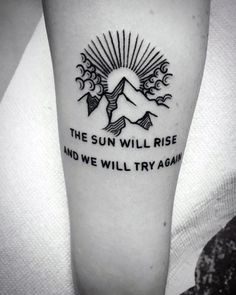 the sun will rise and we'll try again tattoo on the left inner arm