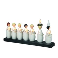 a group of figurines sitting on top of a shelf