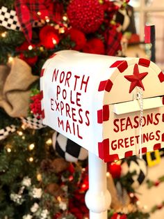 a mailbox is decorated with red and white letters that read north pole express mail