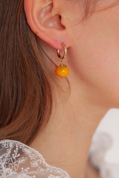 Introducing our Orange earrings! Featuring our brand new Orange charm! <3  Every picnic blanket piece is lovingly designed and handcrafted completely in-house and perfectly finished in our jewellery studio.  Every individual glass feature charm takes around half an hour to delicately form by hand in the flame, reaching temperatures of up to 800 degrees celsius, before heading to the kiln to soak for around 8 hours in the warmth to ensure strength and longevity. The charms are then washed by hand Orange Small Hoop Earrings For Gift, Small Hoop Earrings Orange For Gift, Small Hoop Earrings Orange Gift, Small Hoop Earrings In Orange For Gifts, Orange Hoop Earrings With Ear Wire For Gift, Orange Hoop Earrings With Ear Wire As Gift, Gift Orange Hoop Earrings With Ear Wire, Orange Small Hoop Jewelry For Gifts, Orange Small Hoop Jewelry As Gift