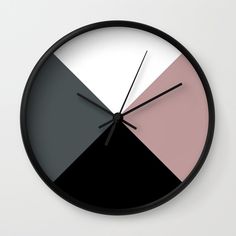 a clock with different colors on the face and numbers in black, grey, pink, and white