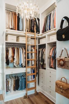 the closet is full of clothes and handbags, with a ladder leading up to it