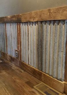 an old corrugated - tin wall is being used as a radiator