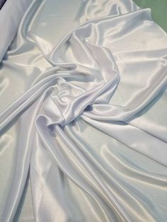 the white fabric is very soft and shiny