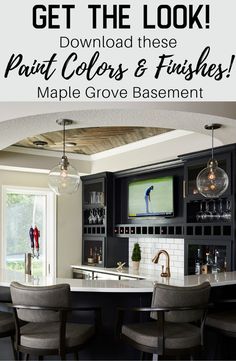 a kitchen with black cabinets and marble counter tops, the text reads get the look paint colors & finishes maple grove basement