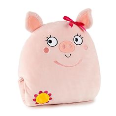 a pink pig pillow with a red bow on it's head and big eyes