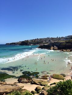 many people are on the beach and in the water at this point, there is no image here to provide a caption for