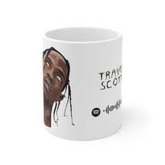 a white coffee mug with the words travis scott on it