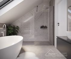 a white bath tub sitting under a bathroom window