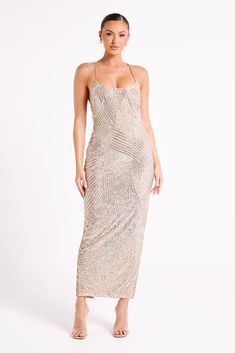 Make the whole place shimmer. TIERRA is a glamorous maxi dress strategically embellished with silver sequin in beautiful figure-enhancing patterns. The halter neckline is graced with delicate thin straps over your otherwise bare shoulders that seamlessly provide maximum support for the dress. The bodycon fit and maxi length combines to create a gorgeous and sexy silhouette so you can leave any occasion with a lasting impression. Style it with the Kailani Platform Heels in a complementary silver Australian Products, Knit Dress Pattern, Vintage Boho Dress, Dress Night Out, Zebra Dress, Dress Silver, Irish Wedding, Plain Dress, Sequin Maxi