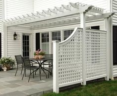 a screen shot of the homepage for an outdoor living area with white pergolan and