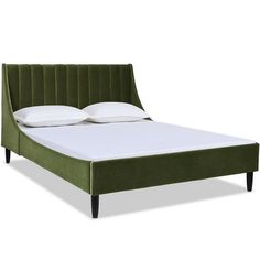 a green bed frame with white pillows on it