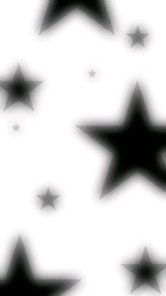 black and white stars are flying in the air