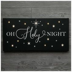 Dimensions: 14" H x 28" W x 1.31" D Power Source: 3 AAA Batteries Required (Not Included) Material: Canvas & MDF Shape: Rectangle Color: Black & White Orientation: Horizontal Includes: 2 D-Rings Age Grade: 14+ Care & Safety: Do Not Hang With Wire Quantity: 1 Bring the spirit of Christmas to your home with this Light Up Oh Holy Night Canvas Wall Decor. This canvas piece features a starry black background with the phrase "Oh Holy Night" written across the front in white font. When you turn it on, some of the stars emit a warm yellow glow, making it look super magical. Display this above your mantel with a cedar garland for the perfect holiday arrangement. Light Up Canvas Christmas, Christmas Hymns Art, Church Christmas Decor, Lighted Canvas Pictures, Jesus Christmas Decorations, Cedar Garland, Light Up Canvas, Glowforge Projects, Christmas Prayer