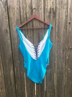 This one piece is incredible and deserves to be out in life again. If you want to look perfect at the beach, pool, lake or anywhere else you go, get this now. It is in great condition and has no rips, holes, stains or smells. Measurements: laying flat and doubled Bust: 31 inches Waist: 26 inches Hips: 31 inches Length: 29 1/2 inches Size on tag: no tag (measures like a medium) Beachy Blue Bodysuit For Swimming, Lined One-piece Bodysuit For Beach, Blue Beachy Bodysuit For Beach Party, Beachy Blue Bodysuit For Beach Party, Beachy Blue One-piece Bodysuit, Sleeveless Leotard For Poolside Summer, Beachy Blue One-piece For Sunbathing, Beachwear Leotard For Beach Season, Blue Bodysuit For Beach Party Season