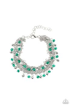 Dainty silver and green crystal-like beads cascade from two shimmery silver chains. Infused with plain silver chains, the colorful strands layer around the wrist for a flirtatious look. Features an adjustable clasp closure.

Sold as one individual bracelet. 

Get The Complete Look! 
Necklace: "Financially Fabulous - Green" (Sold Separately) Collar Verde, Green Bracelet, Silver Chains, Paparazzi Accessories, Bracelet Clasps, Paparazzi Jewelry, Green Necklace, Green Crystals, Jewelry Party