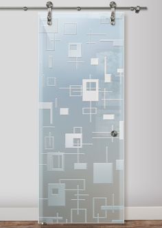 a glass door with an abstract design on the front and side panels, hanging from a metal rod