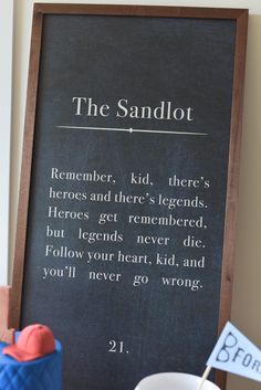 the sandlot poem is written on a chalkboard next to a cup with a straw in it