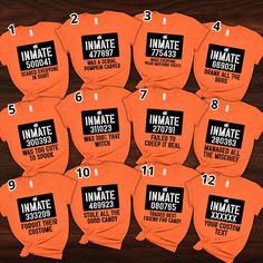 twelve orange shirts with white numbers and the names of eight different groups in black on them