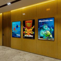 there are three movie posters on the wall next to each other in an elevator area