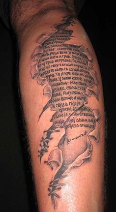 a man with a tattoo on his arm that has words written in many different languages