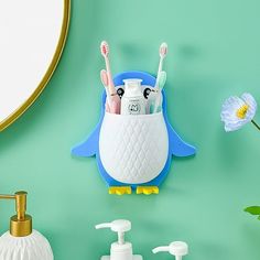 the toothbrush holder is shaped like a penguin