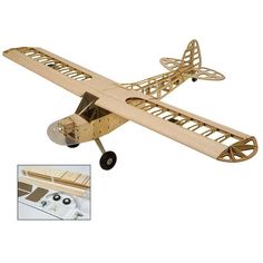 a wooden model airplane sitting on top of a table