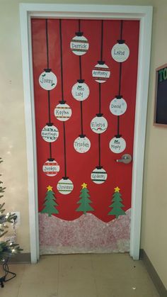 a door decorated with christmas trees and signs